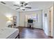 Bedroom featuring a ceiling fan, a bed, and a window at 318 Australian Way, Davenport, FL 33897