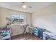 Bedroom featuring natural light and wood floors, offering a versatile space for work or relaxation at 318 Australian Way, Davenport, FL 33897
