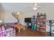 Inviting living room with ceiling fans and a comfortable seating area and media area at 318 Australian Way, Davenport, FL 33897