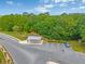 Scenic aerial view of the parking area surrounded by mature trees and landscaping at 318 Australian Way, Davenport, FL 33897