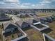 Aerial view of residential homes showing backyards, fencing, and the layout of a suburban neighborhood at 3341 Lounging Wren Ln, Bartow, FL 33830