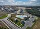 A lovely aerial view of the community pool, playground, and clubhouse surrounded by new homes and lush landscaping at 3341 Lounging Wren Ln, Bartow, FL 33830