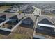 Community homes' aerial view showing backyard fences, patios, landscaping and neighborhood street patterns at 3341 Lounging Wren Ln, Bartow, FL 33830