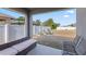 Spacious backyard featuring a white fence, covered patio, metal chairs and a vegetable garden at 3341 Lounging Wren Ln, Bartow, FL 33830