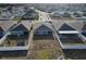 Backyard aerial view showing fence lines, with some yards featuring trampolines or covered patios at 3341 Lounging Wren Ln, Bartow, FL 33830