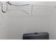 Functional walk-in closet equipped with a wire shelf and a sleek black suitcase at 3341 Lounging Wren Ln, Bartow, FL 33830