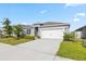 Beautiful single Gathering home featuring a 2-car garage and a well maintained, landscaped yard at 3341 Lounging Wren Ln, Bartow, FL 33830