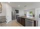 Spacious kitchen featuring an island, granite countertops, stainless steel appliances, and tile flooring at 3341 Lounging Wren Ln, Bartow, FL 33830