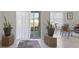 Living room with sliding glass door to the backyard and an indoor dining area at 3341 Lounging Wren Ln, Bartow, FL 33830