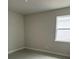 A bright bedroom featuring tile flooring and a window at 3450 Mclain Preserve Pt, Sanford, FL 32771