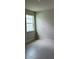 Bright bedroom with a window and tile flooring at 3450 Mclain Preserve Pt, Sanford, FL 32771