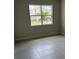 Bedroom with a large window and tiled floors at 3450 Mclain Preserve Pt, Sanford, FL 32771