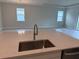 Kitchen island featuring a sink with stainless steel appliances at 3450 Mclain Preserve Pt, Sanford, FL 32771