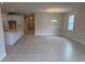Bright, open-concept living area featuring tile flooring, a modern chandelier, and natural light at 3450 Mclain Preserve Pt, Sanford, FL 32771