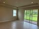 A room with tile flooring and sliding glass doors showcasing outdoor views at 3450 Mclain Preserve Pt, Sanford, FL 32771