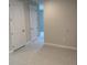 Neutral-colored room with two white doors and tile flooring at 3450 Mclain Preserve Pt, Sanford, FL 32771