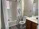 Bathroom featuring a tub and shower, single sink vanity and light gray vinyl flooring at 4001 San Sabastian Dr # 107, Kissimmee, FL 34741