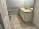 Bathroom features tile floor, toilet, and vanity with sink at 4001 San Sabastian Dr # 107, Kissimmee, FL 34741