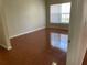 Clean bedroom with tile flooring, a window for natural light, and closet space at 4001 San Sabastian Dr # 107, Kissimmee, FL 34741