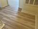Hallway featuring modern flooring, neutral-tone walls, and white trim for a clean and stylish interior at 4001 San Sabastian Dr # 107, Kissimmee, FL 34741