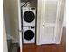 Convenient laundry area featuring a stackable washer and dryer with a storage closet at 4001 San Sabastian Dr # 107, Kissimmee, FL 34741