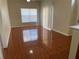 Bright living area with tile floors, large windows, and neutral walls, offering a cozy space at 4001 San Sabastian Dr # 107, Kissimmee, FL 34741