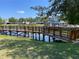 Community pond with dock at 4001 San Sabastian Dr # 107, Kissimmee, FL 34741