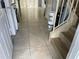 Hallway featuring tile flooring, with stairs on the right at 4001 San Sabastian Dr # 107 Of 51, Kissimmee, FL 34741