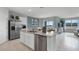 Open kitchen design with stainless steel appliances, central island and views to the living area at 404 Taylor Groves Dr, Lake Wales, FL 33853