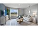Cozy living room with a large window, comfortable sofa, and stylish decor at 404 Taylor Groves Dr, Lake Wales, FL 33853