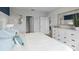 Relaxing main bedroom has a dresser, ensuite bathroom, and serene decor at 404 Taylor Groves Dr, Lake Wales, FL 33853