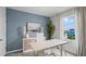 Inviting office features blue accent wall, coastal decor, and a table with a view at 404 Taylor Groves Dr, Lake Wales, FL 33853