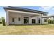 Spacious backyard with covered patio and well-maintained lawn provides an ideal outdoor space at 4047 Isabella Cir, Windermere, FL 34786