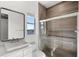 Contemporary bathroom featuring a rectangular sink, dark framed mirror, and glass-enclosed shower with modern tile at 4047 Isabella Cir, Windermere, FL 34786