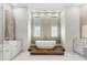 Elegant bathroom with a modern tub, dual vanities, and sleek, minimalist design at 4047 Isabella Cir, Windermere, FL 34786