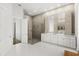 Luxurious bathroom features dual sinks, a walk-in shower, and modern finishes at 4047 Isabella Cir, Windermere, FL 34786