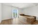 Bright bedroom with platform bed, wood accents, a large window and french doors to the outside at 4047 Isabella Cir, Windermere, FL 34786