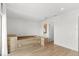 Bright bedroom showcasing custom platform bed with built in storage, hardwood floors, and access to bathroom at 4047 Isabella Cir, Windermere, FL 34786