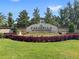 Entrance to the prestigious Casabella at Windermere community featuring lush landscaping and manicured lawns at 4047 Isabella Cir, Windermere, FL 34786