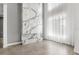 Striking floor-to-ceiling marble fireplace creates a focal point in the modern living space at 4047 Isabella Cir, Windermere, FL 34786