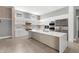 Modern kitchen with a large island, stainless steel appliances, custom cabinets, and ample space for cooking at 4047 Isabella Cir, Windermere, FL 34786