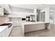 Spacious, modern kitchen features stainless steel appliances, a large island, and sleek cabinets, perfect for entertaining at 4047 Isabella Cir, Windermere, FL 34786