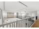 Open landing overlooking living area features wood floors and modern design at 4047 Isabella Cir, Windermere, FL 34786