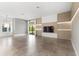 Open living area features a modern entertainment center, large windows, and lots of natural light at 4047 Isabella Cir, Windermere, FL 34786