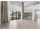 Open concept living area with high ceilings, modern finishes, neutral color palette and large windows at 4047 Isabella Cir, Windermere, FL 34786