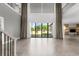 Bright and airy living area featuring large windows, soaring ceilings, and seamless indoor-outdoor flow at 4047 Isabella Cir, Windermere, FL 34786