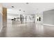 Open-concept living space boasts an island kitchen, modern lighting and finishes, with staircase access at 4047 Isabella Cir, Windermere, FL 34786