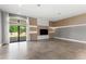 Bright, open-concept living room with recessed lighting, wood accents, and sliding doors to the outside at 4047 Isabella Cir, Windermere, FL 34786