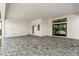 Large covered outdoor patio with a stone floor and sliding glass doors offers great backyard access at 4047 Isabella Cir, Windermere, FL 34786