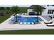 The luxurious pool has stylish lounge chairs, umbrellas, and palm trees at 4047 Isabella Cir, Windermere, FL 34786